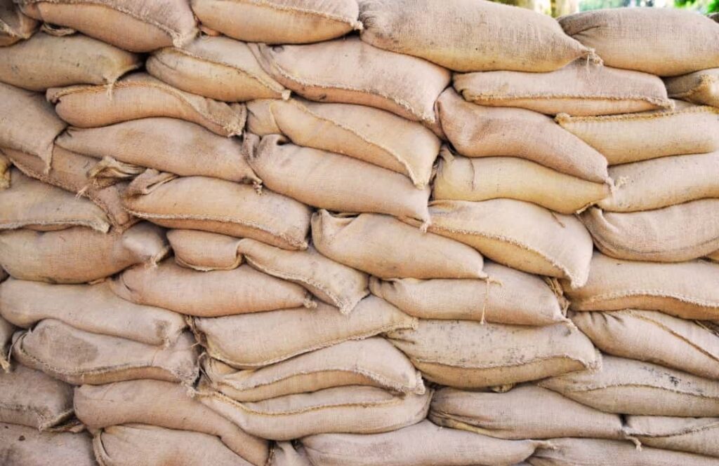Farmers in Nigeria loading grains into 100 kg biodegradable jute sacks supplied from Bangladesh